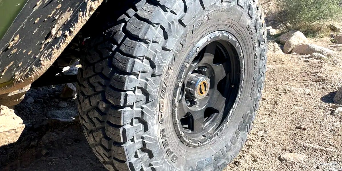 All-terrain tire on off-road vehicle in desert