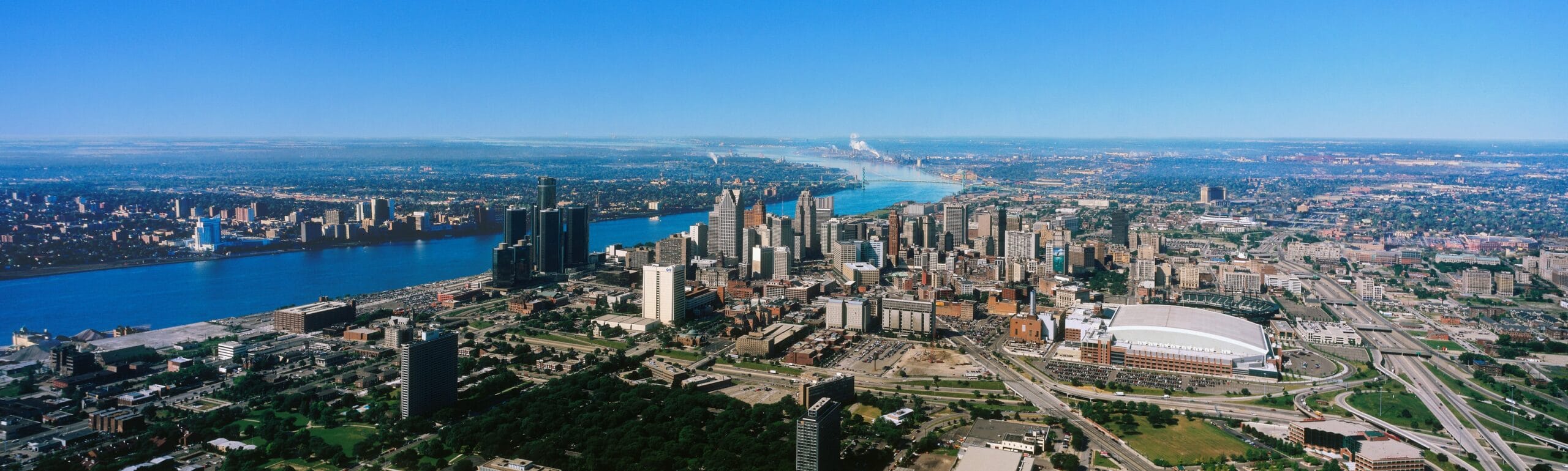 Aerial view of Detroit skyline and river.