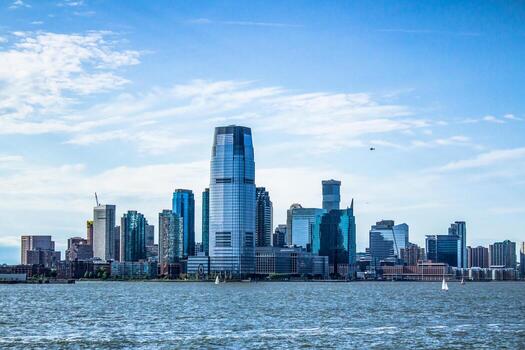 Jersey City skyline with skyscrapers and waterfront.