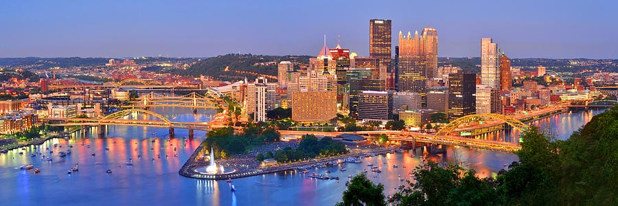Pittsburgh skyline and rivers at sunset.