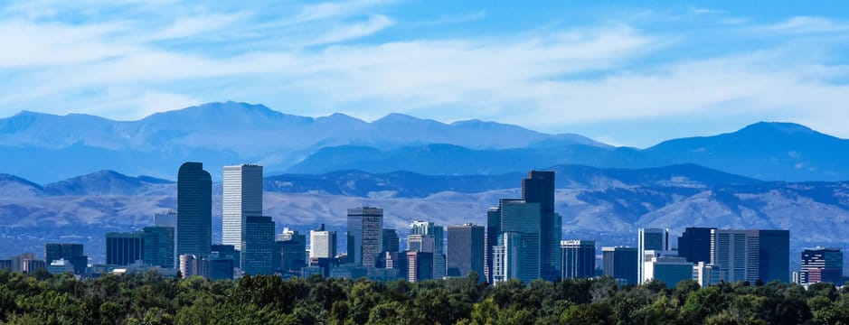 Denver skyline with mountains in background - wheels and tires