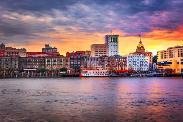 Savannah skyline at sunset by the river.