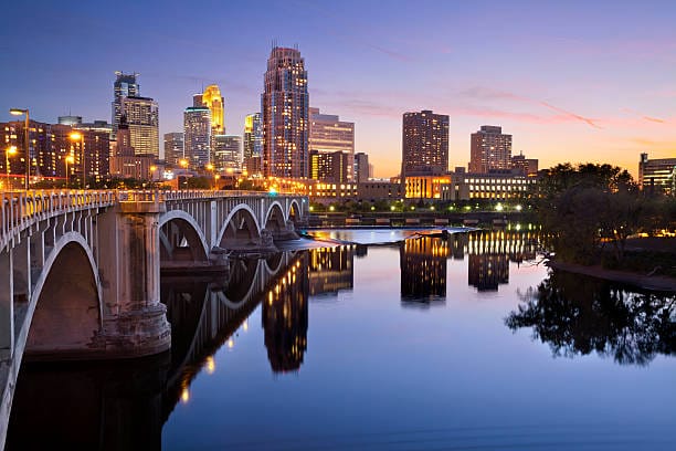 Minneapolis skyline and bridge at dusk reflection