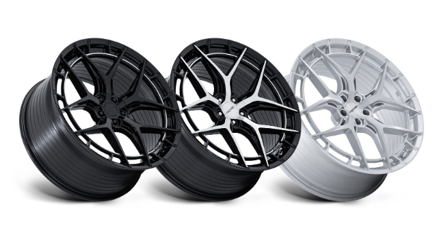 Three stylish car rims in black and silver.