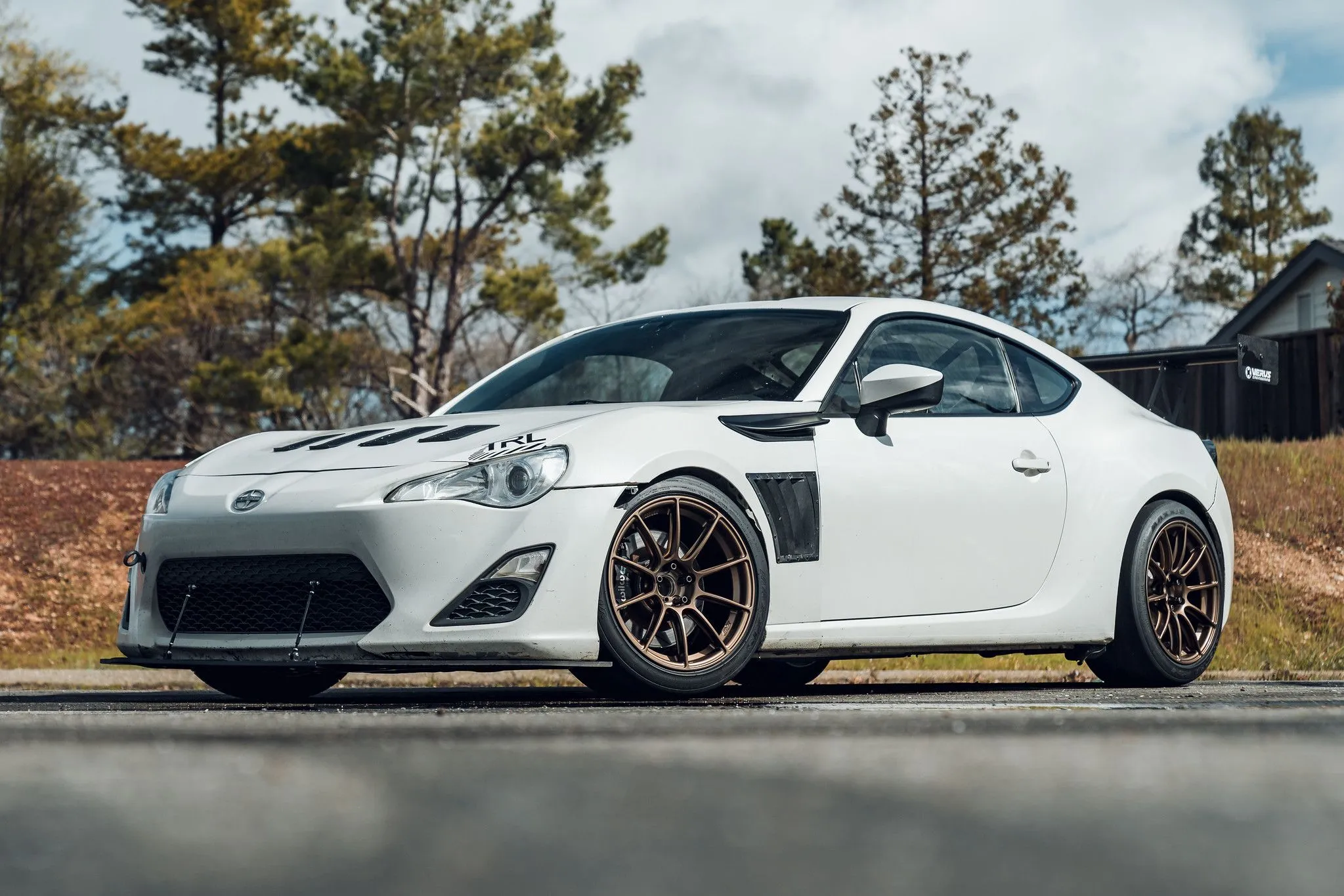 White sports car parked on scenic road Scion FR-S Wheels & Rims – Guaranteed Fitment
