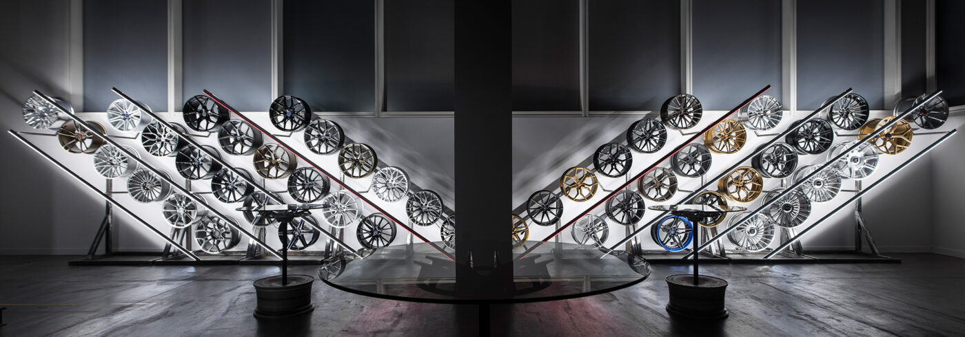 Modern car wheel display with various designs.