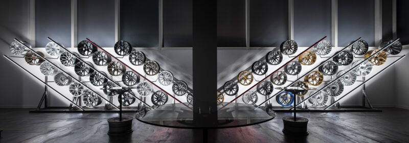 Modern car wheel display with various designs.